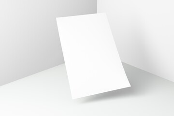 Flying blank sheet note paper on white corner floor