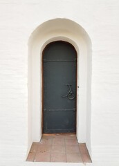 Fototapeta premium Antique iron door in a stone house