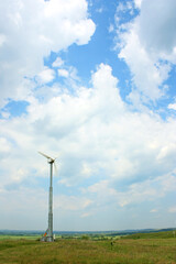 Fototapeta na wymiar Wind turbines in the field generates electricity