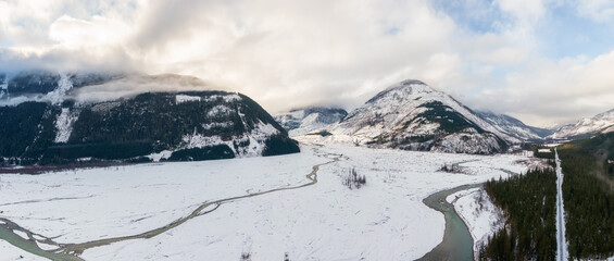 Aerial Panoramic View of Beautiful Canadian Nature Landscape. Snow Covered in Winter. Located near Pemberton, British Columbia, Canada. Background Panorama