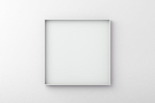 White square frame on an empty wall