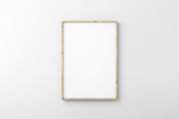 Thin wooden empty frame on white wall for mockup