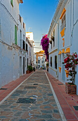 Narrow cobblestone street in the resort town of Marbella, Spain