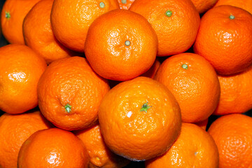 close-up on a pile of tangerines. selective focus