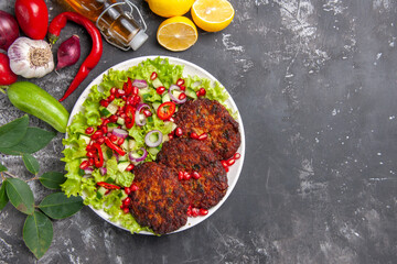 top view delicious meat cutlets with fresh salad on a grey background meal photo food dish