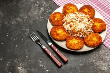 top view fried cutlets with cooked rice on dark desk meat dish rissole