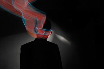 Man in the dark and neon glasses