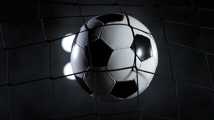 Soccer ball flying into net, goal success concept.
