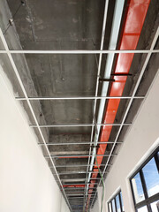 Obraz premium KUALA LUMPUR, MALAYSIA -APRIL 26, 2020: Installation of suspended ceiling frame and finishes. All the above-ceiling services and equipment. installed before that. All the installation work to be coord