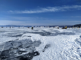 Frozen lake baikal, tourist trip in winter on baikal
