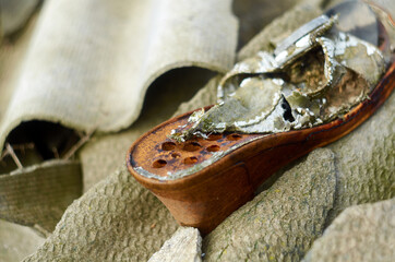 Photo of women's shoe on junkyard