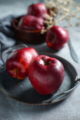 red delicious apple in metal plate