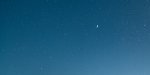 Obraz na płótnie Canvas Beautiful moon, on the starry blue sky .Astronomical background. Night photography.