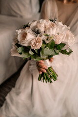 Beautiful bouquet, bridal bouquet, flowers of the bride. The bride is waiting for the groom.