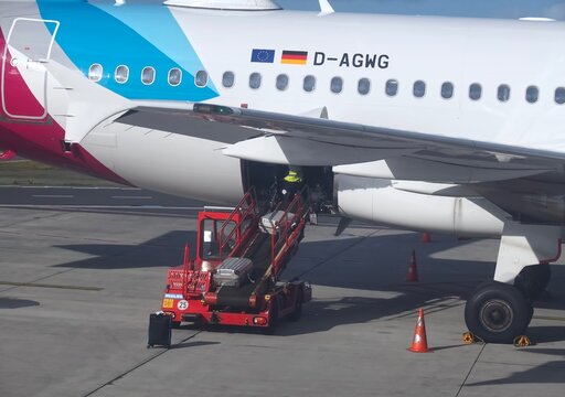 World of aircraft - Eurowings airplane at Faro airport is loaded with baggage