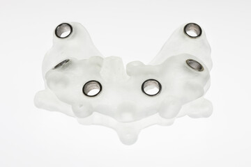 surgical dental template on a white background for the implantation of six implants