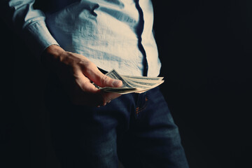 man counts money calculating finance