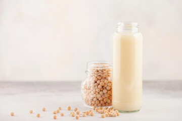 Vegetable pea milk in a bottle and peas in a jar. Gluten free, lactose free product