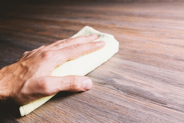 male hands clean the table.