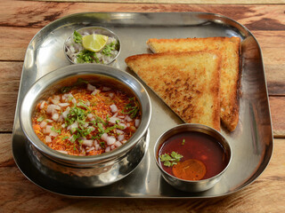 Bread toast with Misal, Poona misal or Puneri Misal is a special and popular item in Pune, Maharashtra. The dish is eaten for breakfast or as a midday snack or meal, served with toasted bread
