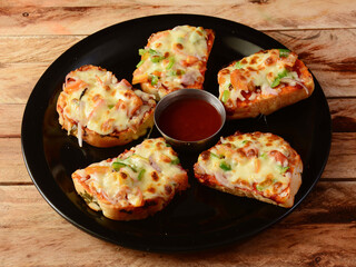 Cheese garlic bread, served over a rustic wooden background, selective focus