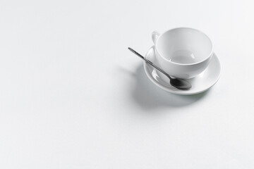 Top view of empty cup on white background desk for mockup
