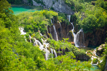 Top view of Plitvice Lakes with waterfalls and surrounding forest