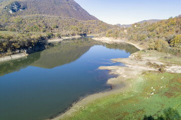 Naklejka na ściany i meble Aerial view of Lake Turano in Rieti, Castel di tora, colle di tora and Ascrea lakeside villages