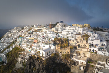 Fototapeta na wymiar imerovigli, Santorini island with colorful volcanic cliffs and deep blue sea aerial view