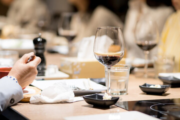 The wine glasses are placed on the table in the restaurant at the party