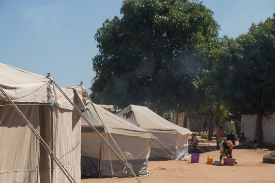 Refugee camp made of tents, people living in very poor conditions, lack of clean water, access to health