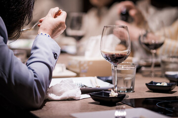 The wine glass was placed on the table in the restaurant at a dinner party