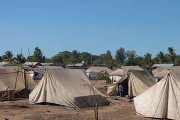 Refugee camp made of tents, people living in very poor conditions, lack of clean water and access to health