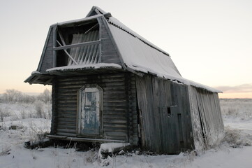 old abandoned hut in winter