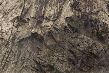 Rock texture and surface background. Cracked and weathered natural stone background.