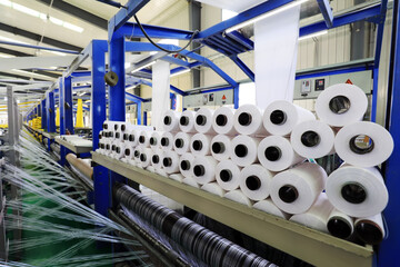 Bobbin in the packaging products processing line in a factory, North China