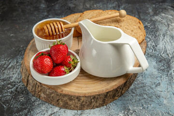 front view fresh strawberries with honey on dark background fruit sweet jelly