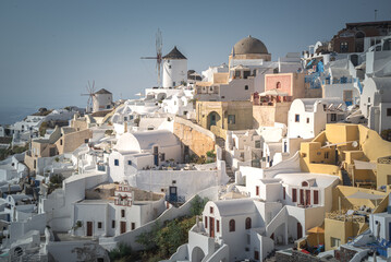 Greece Traveling. View of Greek Traditional Colorful Houses and Windmills of Oia or Ia at Santorini...