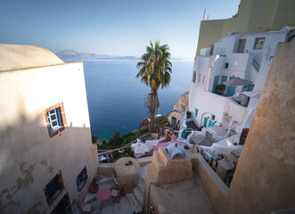 Greece Traveling. View of Greek Traditional Colorful Houses and Windmills of Oia or Ia at Santorini...