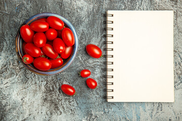 top view fresh red tomatoes with notepad on dark-light background fruit photo dark salad
