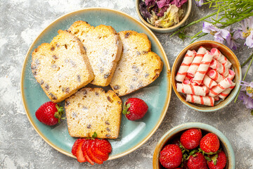 top view yummy cake slices with strawberries on a light background pie sweet cake