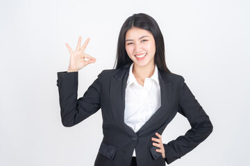 Portrait beautiful working asian woman with happiness showing ok hand sign for perfection business on white background