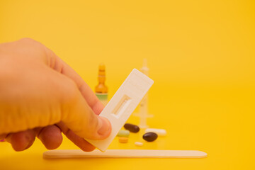 Hand showing the antigen test.