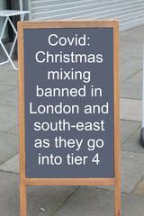 Covid tier 4 message, Christmas mixing banned in London  and south east on a chalk board