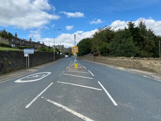 The main road, as it enters the village of, Queensbury, Bradford, UK