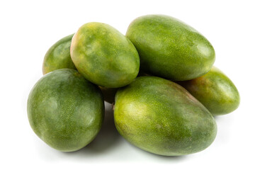 a pile of large ripe green mangoes from Brazil isolated on white