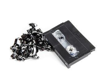 computer data security - a computer digital backup tape cartridge which has been destroyed before disposal isolated on white