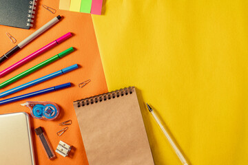 colored cardaches brown notepad orange yellow background