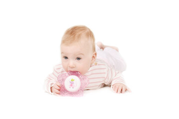 Cutest little 4 month old caucasian baby girl in striped T-shirt biting teether, isolated on white. Baby care and health concept. Copy space.