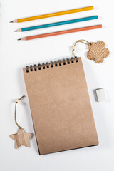 Brown notepad spiral wooden objects bright pencils stationery